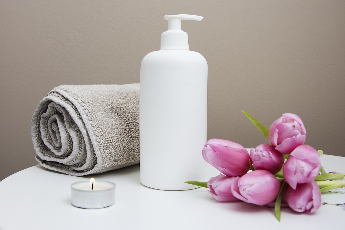 Fresh towels, flowers, and massage lotion prepared for a session